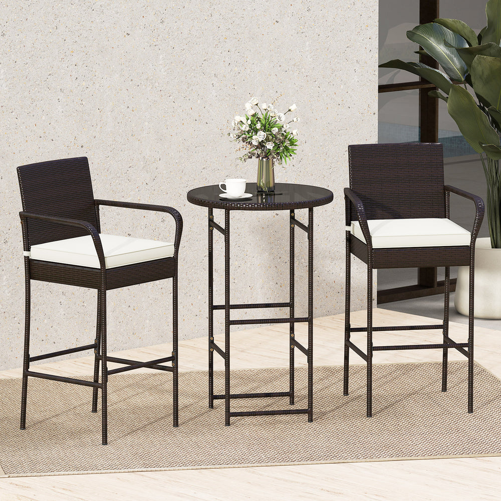 Outdoor bar set featuring two cushioned stools and a round table, made of PE wicker for patio relaxation.