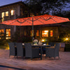 Patio dining set with LED umbrella, featuring navy cushions and hand-woven PE rattan, perfect for outdoor gatherings.