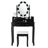 Black cushioned stool with premium sponge filling, designed for comfort and elegance, complements the makeup dressing.