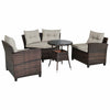 4-piece outdoor wicker sofa set with soft cushions and tempered glass coffee table, ideal for patio or garden.