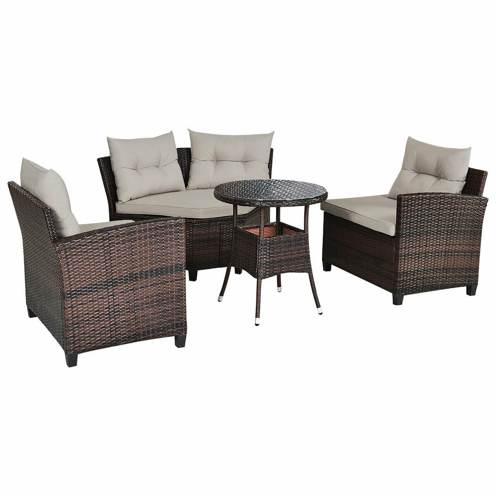 4-piece outdoor wicker sofa set with soft cushions and tempered glass coffee table, ideal for patio or garden.