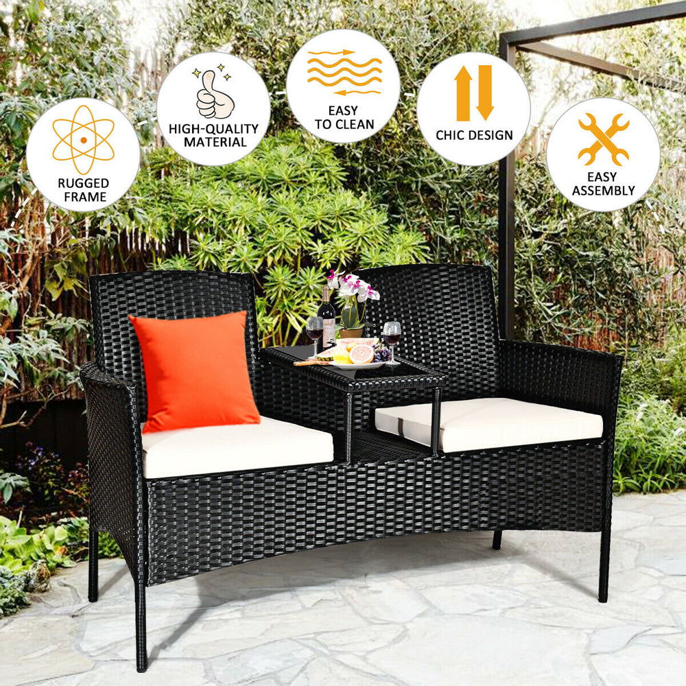 Wicker patio conversation set with removable cushions, tempered glass table, and ergonomic design for outdoor.