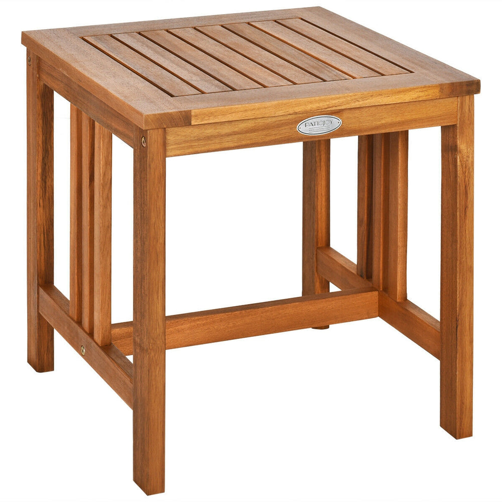 Acacia wood patio table with slatted top, perfect for outdoor relaxation in rustic teak color. Ideal for tea time.