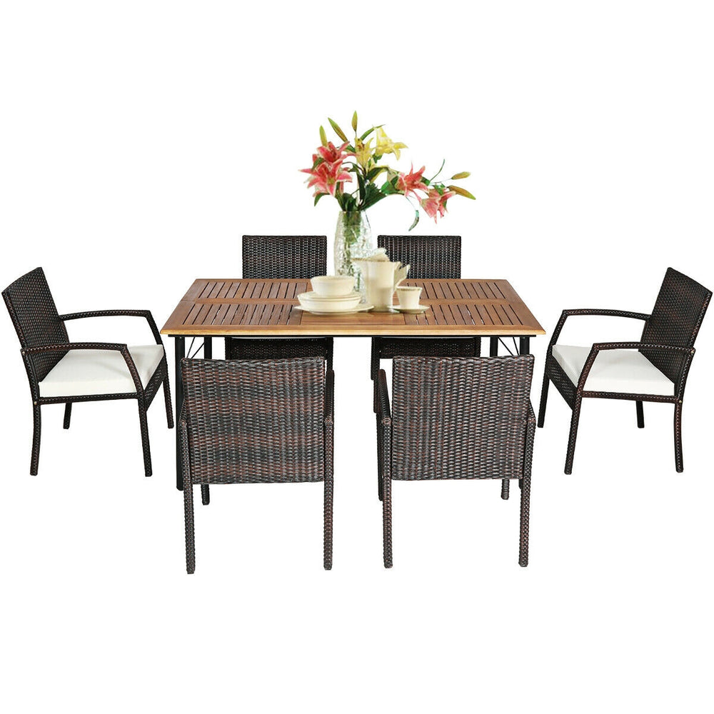 Close-up of the cushioned armchair from the 7PCS patio dining set, highlighting the durable PE rattan and soft cushion.