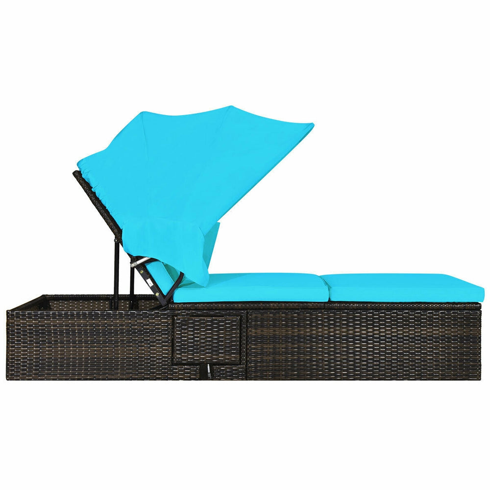Turquoise outdoor chaise lounge chair profile view, featuring a retractable canopy and sponge-padded cushion for.