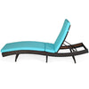 Side view of a turquoise cushion on a folding adjustable rattan chaise lounge chair, ideal for compact outdoor storage.