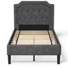 Upholstered twin platform bed with button-tufted headboard and wooden slats for sturdy support and under-bed storage.