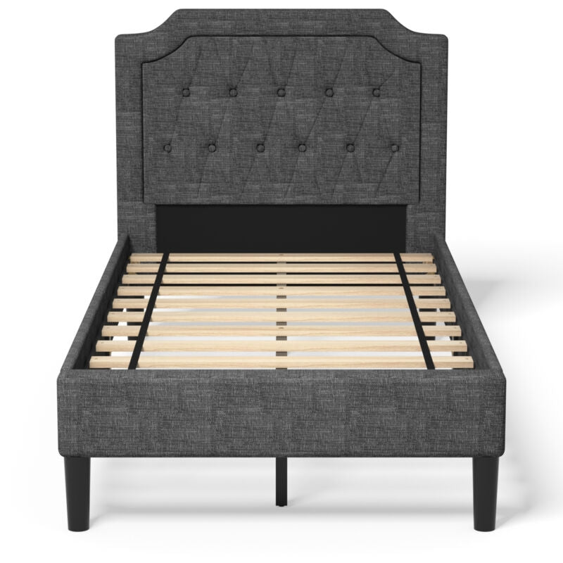 Upholstered twin platform bed with button-tufted headboard and wooden slats for sturdy support and under-bed storage.