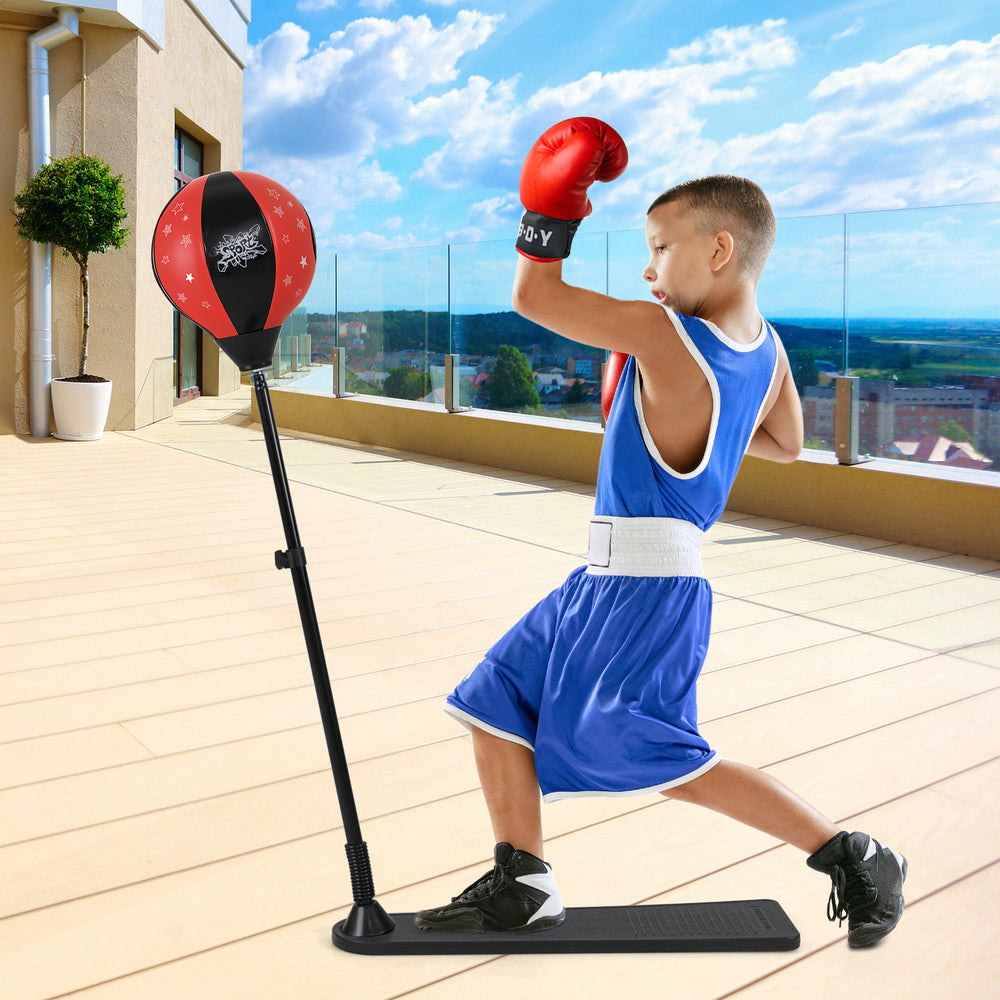 Kids punching bag with adjustable stand, red and black color, promoting hand-eye coordination and confidence.