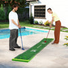 Putting green mat with adjustable putters and balls, perfect for indoor or outdoor play, set up by two players.