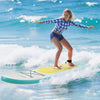 A young woman surfing on an 11-foot inflatable stand-up paddle board in vibrant blue waters, showcasing stability and.