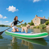 Inflatable 11 feet stand up paddle board with a non-slip deck, paddler, and dog, perfect for water adventures.