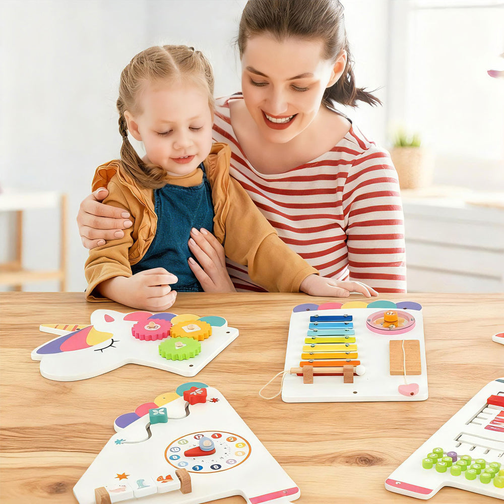 Close-up of a colorful dinosaur activity wall busy board for toddlers, showcasing a rotary gear and shape.