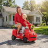 Bright red 12V Chuggington kids ride-on train with adjustable seat, enjoyed by a child and parent outdoors.