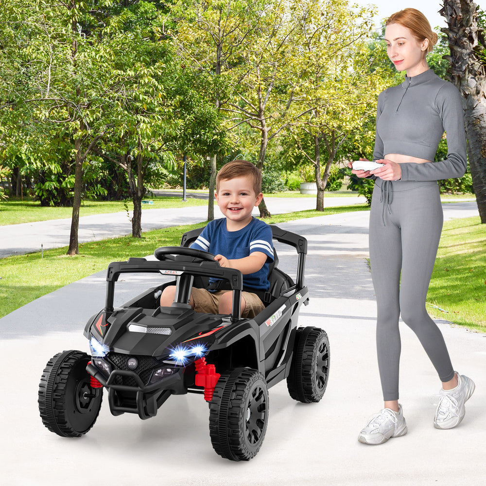Kids ride-on car UTV in black with LED lights, remote control, and safety features for outdoor fun.