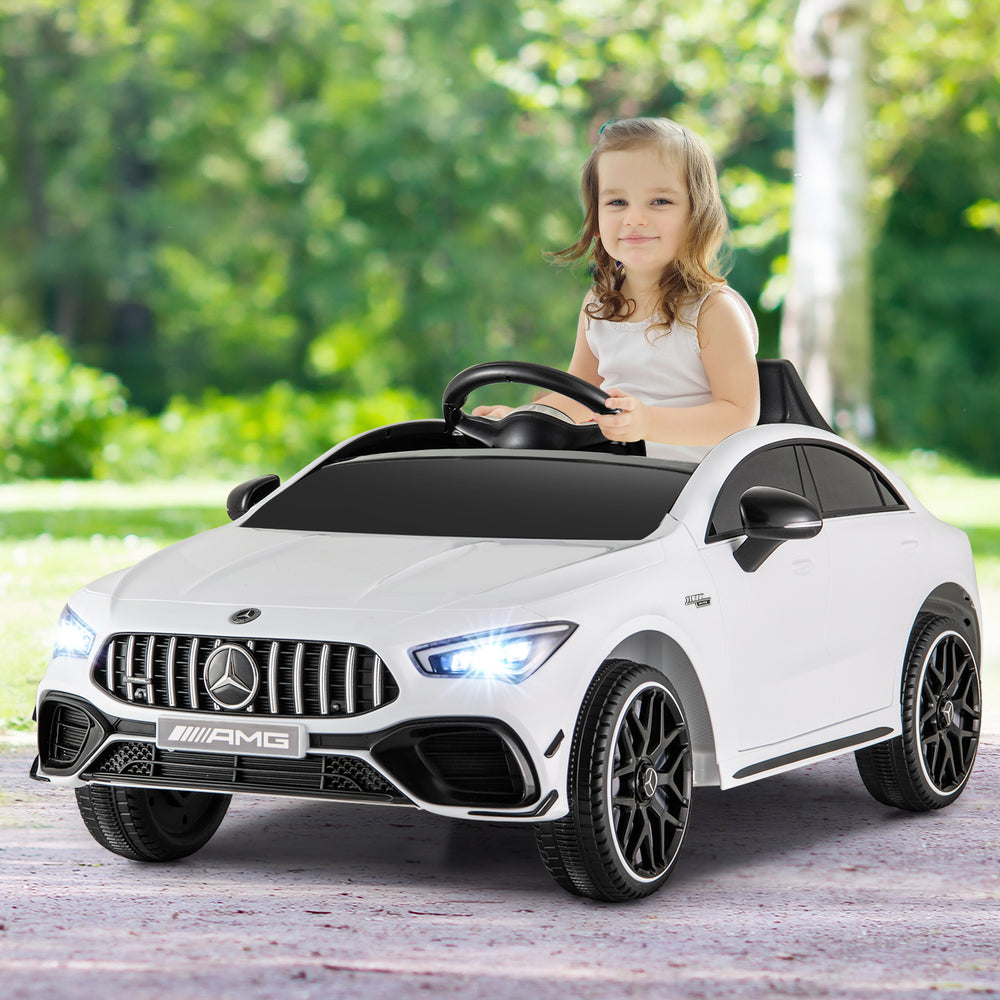 Kids ride-on car Mercedes-Benz AMG CLA 45 in white, featuring LED lights and remote control for safe driving fun.