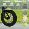 Close-up of the 12-inch pneumatic tire on a green kids bike, designed for wear resistance and strong grip on various.
