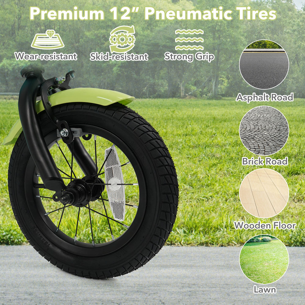 Close-up of the 12-inch pneumatic tire on a green kids bike, designed for wear resistance and strong grip on various.