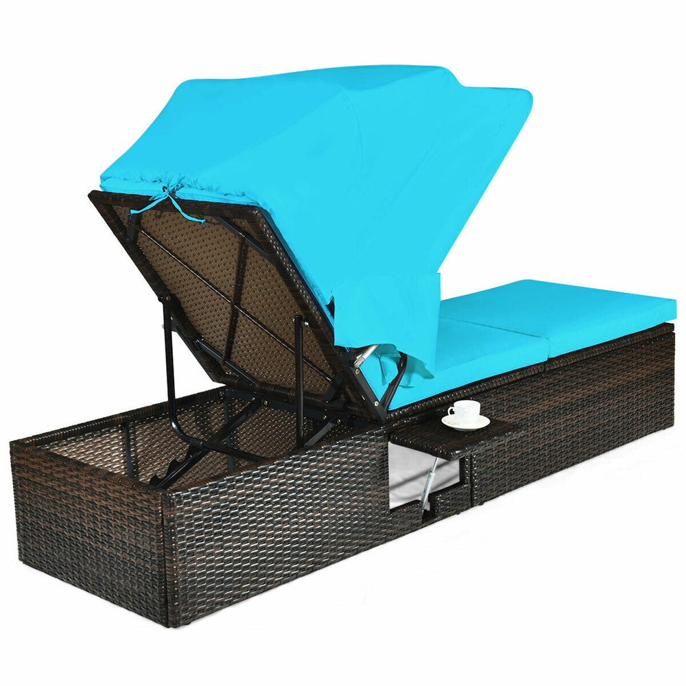 Turquoise chaise lounge chair with a folding canopy and cup table, made from durable PE rattan for convenient outdoor.