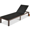 Black rattan chaise lounge chair with adjustable backrest and wheels, perfect for outdoor relaxation by the pool or.