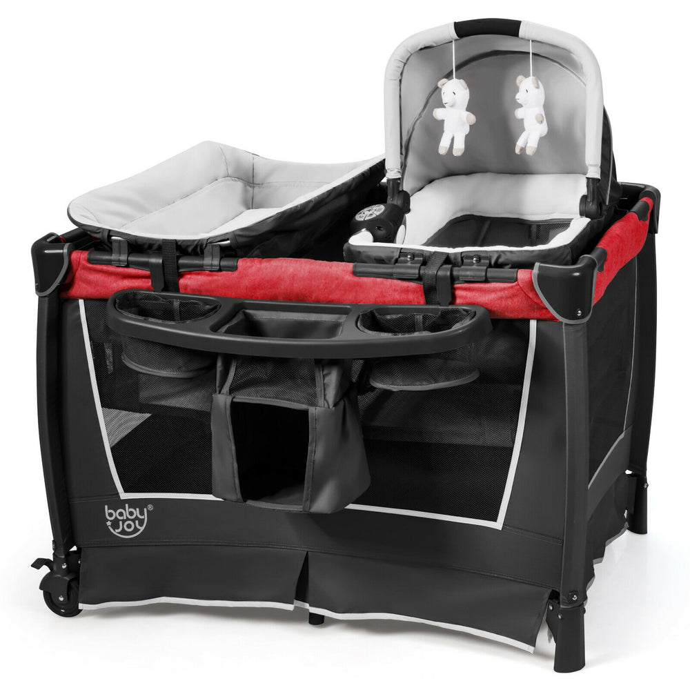 4-in-1 convertible portable baby play yard in red, featuring a cradle, changing table, and hanging toys for versatile.