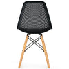 Black plastic hollow chair with beech wood legs, featuring a curved backrest for ergonomic support and breathability.