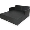 Spacious outdoor rattan daybed with upholstered cushions, featuring armrests and a curved backrest for comfort.