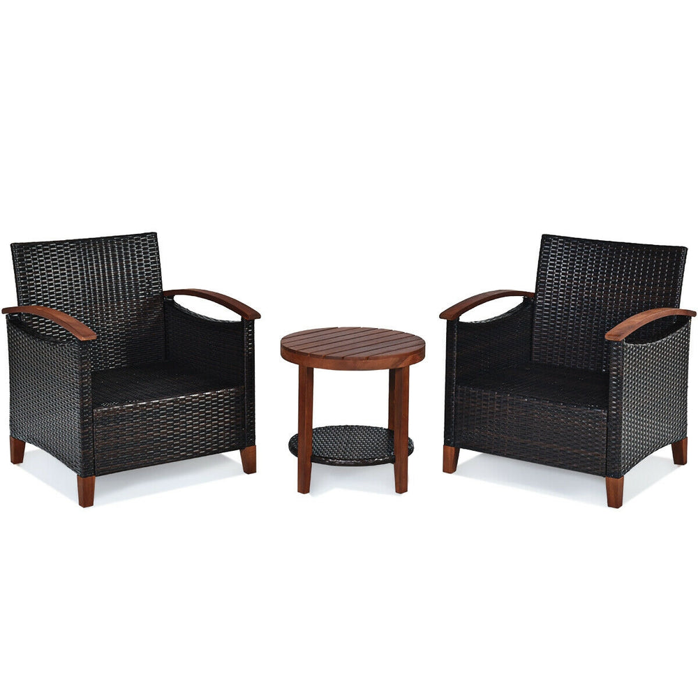 Patio rattan furniture set featuring two chairs with thick cushions and a round acacia wood coffee table for outdoor.