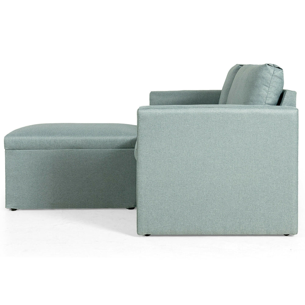 L-shaped sectional sofa in green with reversible chaise, featuring soft linen fabric and thick cushioned pillows.