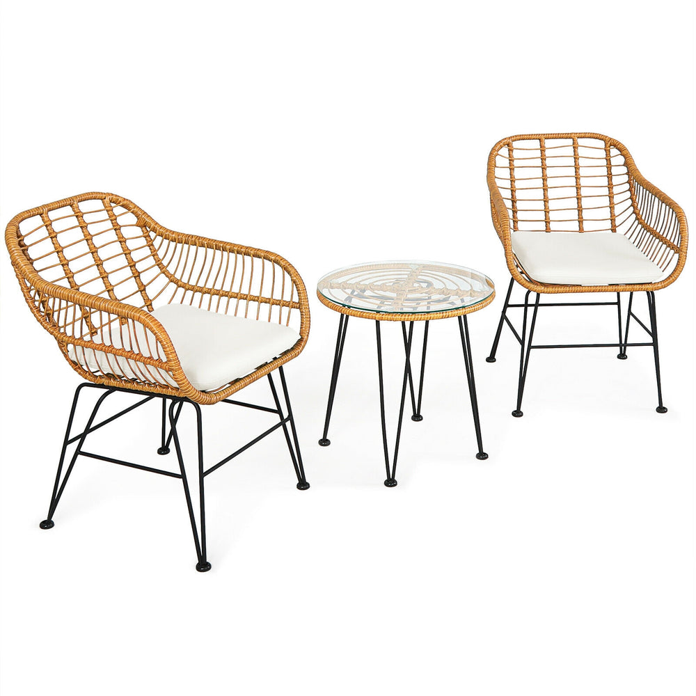 Close-up of the cushioned seat of a rattan chair from the 3-piece set, featuring removable cover for easy cleaning.