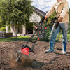 14-inch electric tiller in action, featuring a powerful 10-amp motor, perfect for cultivating small to medium gardens.