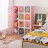 12-cube kids wardrobe closet in pink with cartoon doors, perfect for organizing children's toys and clothes.