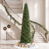 12 FT artificial Christmas tree with 1818 PVC branch tips, showcased in a grand entryway, enhances festive home decor.