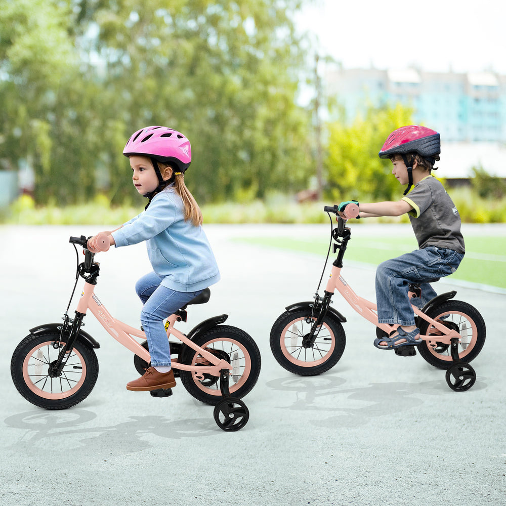 Two kids riding 12-inch pink bikes with removable training wheels, perfect for ages 3-8, promoting balance and.