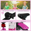 Close-up of the pink 12-inch kids bike with training wheels, featuring a padded seat, bell, and reflectors for safety.