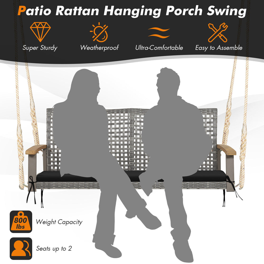 Spacious 2-person patio wicker hanging swing chair in black with gray PE rattan, acacia wood armrests, for outdoor.