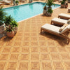 Acacia wood interlocking deck tiles arranged around a pool, showcasing their waterproof design and natural beauty.