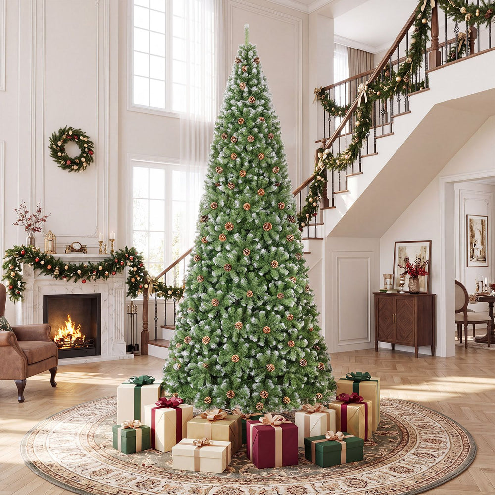 12 ft artificial Christmas tree with 4188 realistic full spruce branch tips, unlit and displayed with gifts in a grand living room.