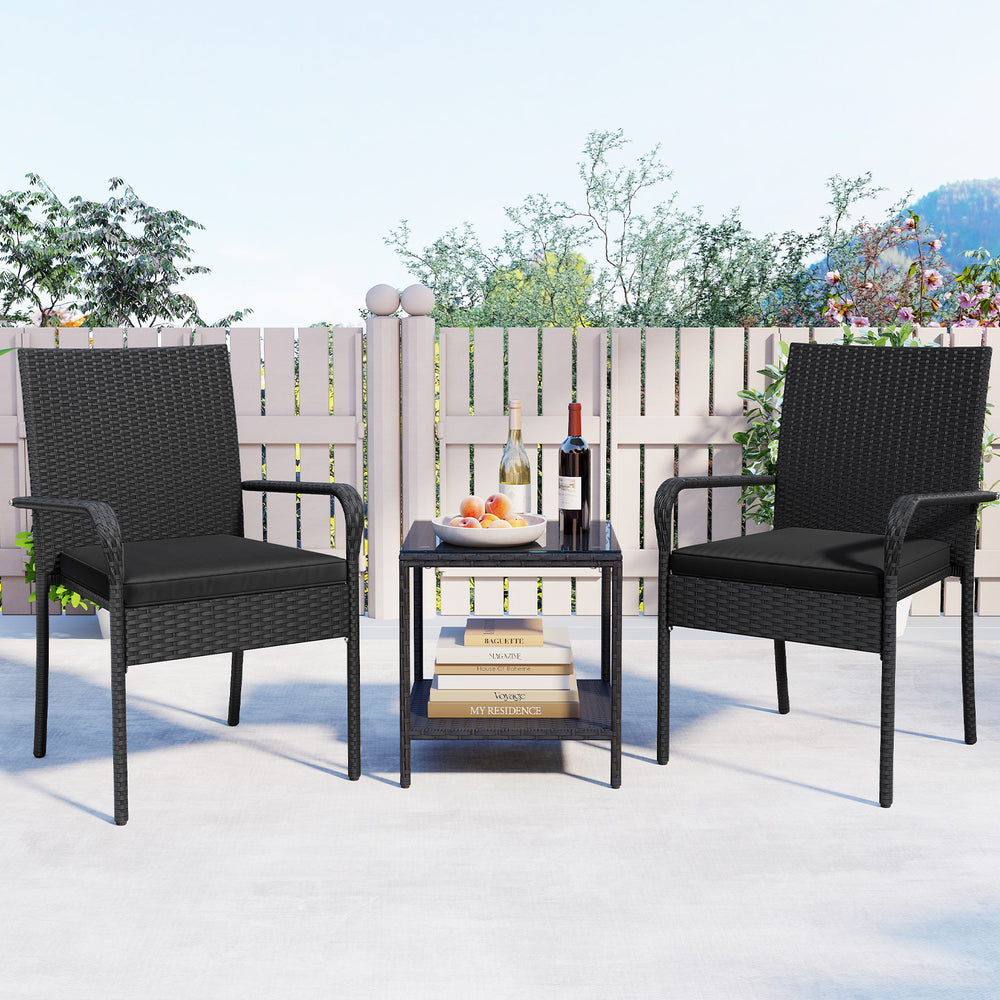 Black 3-piece patio furniture set with cushioned chairs and tempered glass tabletop, ideal for backyard relaxation.