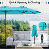 Double-sided turquoise patio umbrella with solar lights, featuring a smooth crank handle and sturdy metal poles for.
