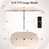 Close-up view of the 13 ft beige patio umbrella's solar panel and crank handle, designed for easy operation and energy.