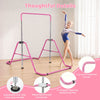 Adjustable pink kids gymnastics bar with 5 height levels, supporting up to 143 lbs for safe practice and storage.