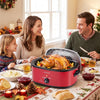 Red 1450W 8 QT electric roaster with self-basting lid, perfect for cooking a whole turkey for family gatherings.