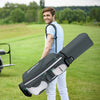 14-way dividers golf cart bag with 7 zippered pockets, lightweight design, carried by a man on a golf course.