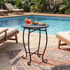 14" floral mosaic patio accent coffee end table with a robust metal frame, perfect for poolside or backyard use.