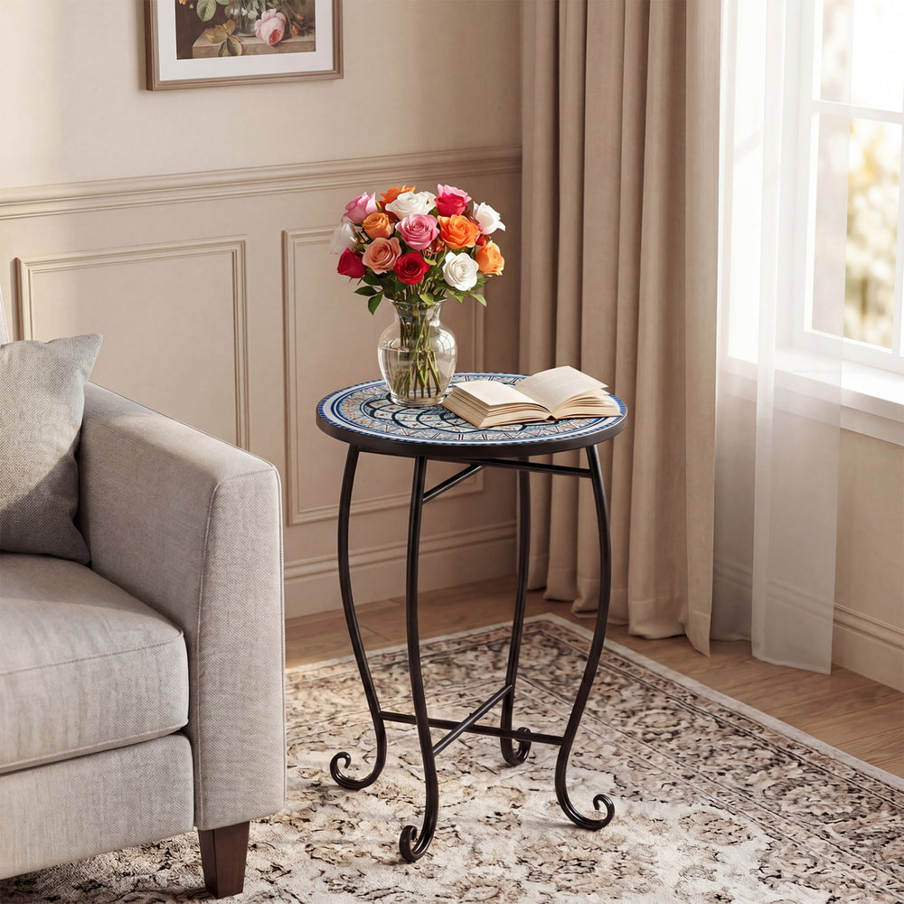 14" floral mosaic accent coffee table with a robust metal frame, perfect for indoor or outdoor use beside a sofa.