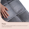 Close-up of the light gray cushioned floor chair showing its textured flannel fabric and padded surface for comfort.