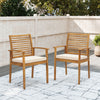 Set of 2 outdoor patio dining chairs in acacia wood with beige removable cushions, featuring a slatted backrest.