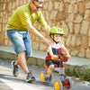 Child riding a brown baby balance bike with 4 wheels, featuring a cute horse head design, outdoors with a parent.