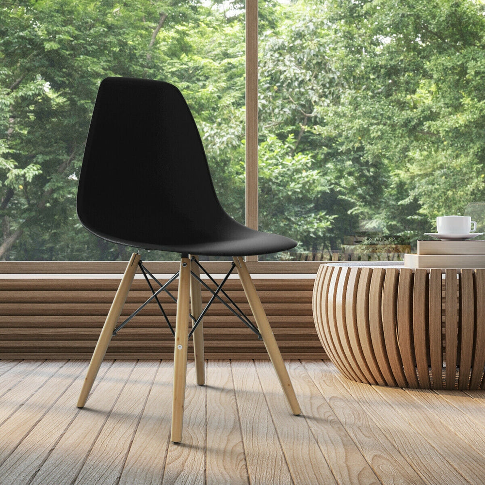 Black Mid-Century Modern DSW dining chair with wood legs, ideal for stylish dining room decor and guest seating.